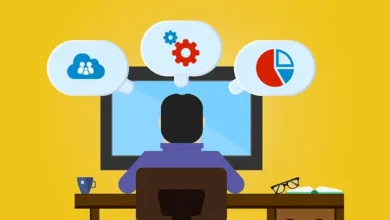 alt="An animated picture of a person probably in software development field working on a table"